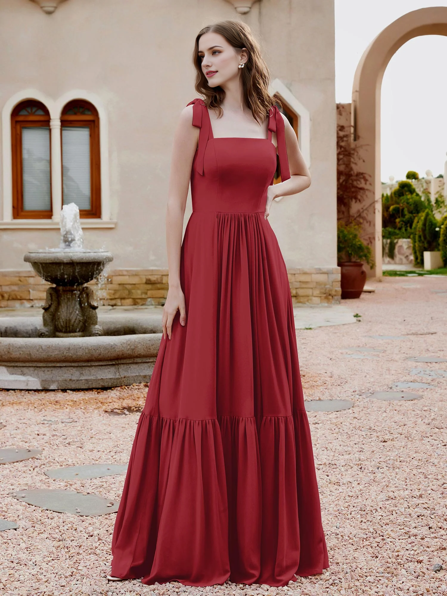 Abito da damigella d'onore in chiffon senza maniche con volant e fiocco a farfalla a trapezio